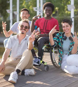 Wheelchair user and friends at the Taproom on Tench bar, laughing